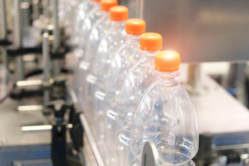 Bottle. Industrial production of plastic pet bottles. Factory line for manufacturing polyethylene...
