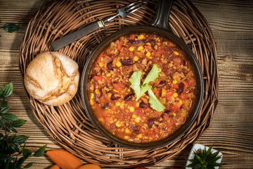 Chili con carne in a clay pan.