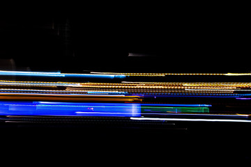 Obraz premium Night city lights background, long exposure. Abstract background.