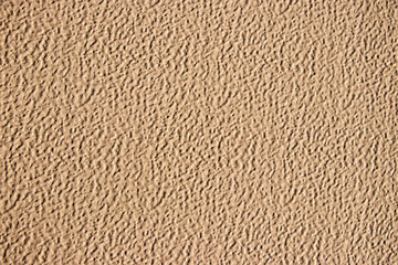 Beige painted grunge wall rough texture