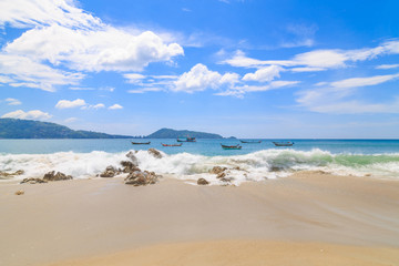 The beach and blue sky /Fishing boat on the sea in phuket Thailand/Beautiful beach under sunshine in Andaman sea/At kalim beach nearly Patong beach Phuket Thailand/