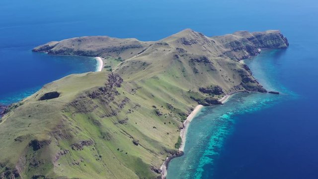 A beautiful coral reef fringes the tropical island of Gili Banta just outside of Komodo National Park. This scenic area of Indonesia is known for its spectacular tropical marine biodiversity.