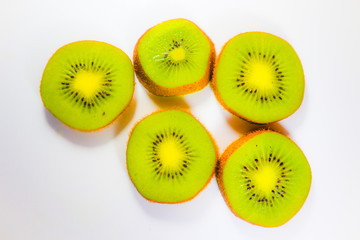 Slices fresh kiwi fruit isolated on white background and wallpaper