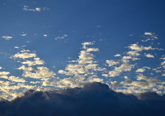 Naklejka na ściany i meble Beautiful dawn with peculiar clouds and intense blue sky background 