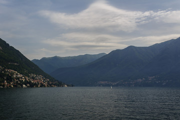 Summer panorama of lake Como. On a background of mountains