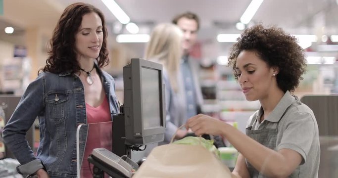 Sales clerk working at grocery store