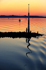 Sailing boats on Lake Balaton at sunset