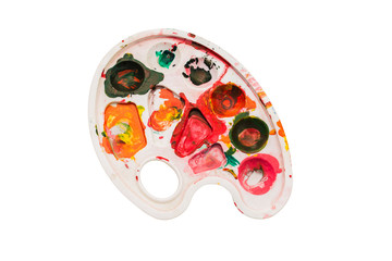 Palette with paints on a white background. Multi-colored spots of paint on the palette. The concept of drawing, art, creativity. Art tools