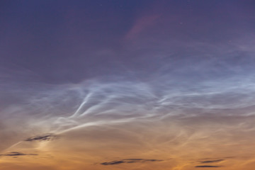 noctilucent clouds at midnight in the sky
