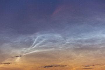 noctilucent clouds at midnight in the sky