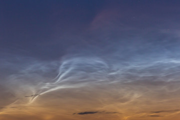 noctilucent clouds at midnight in the sky