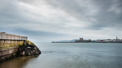 A seascape view of Carrickfergus town from Fisherman's Quay and Downshire Beach.