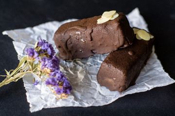 Raw vegan chocolate bars. Healthy desserts, close up