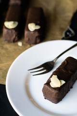 Raw vegan chocolate bars. Healthy desserts, close up