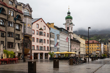 Innsbruck Austria street scene on a rainy foggy day.