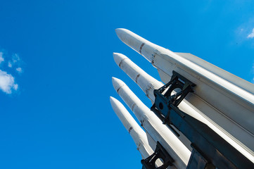 Military concept. Air defense missiles on position against blue sky