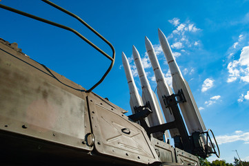 Military concept. Air defense missiles on position against blue sky