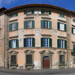 Panoramic view of a renaissance palazzo at Arno riverside in Pisa, Italy