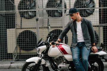Fototapeta na wymiar man with motorcycle near air conditioner