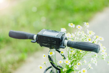 electric scooter wheel with daisy flowers. clean electric cars concept