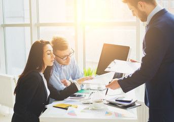 Successful business team with arms crossed at the office