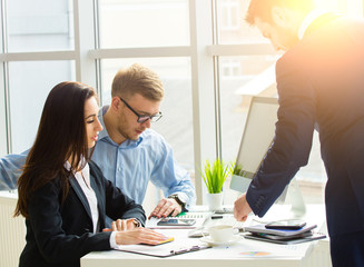 Successful business team with arms crossed at the office