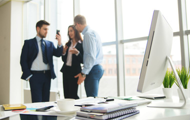 Successful business team with arms crossed at the office