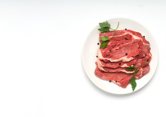 Fresh raw beef steak isolated on white background, top view