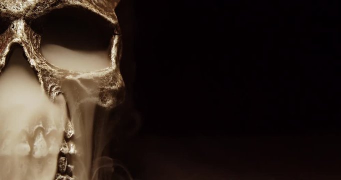 A Tight Shot of a Smoking Skull as the Camera Pans By