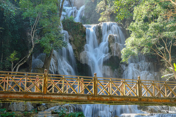 Wood bridge Tat Kuang Si waterfall in Laos.