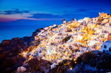 impressive evening view of Santorini island. Picturesque spring sunset on the famous Greek resort Oia, Greece, Europe. Traveling concept background.