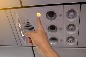 Flight attendant call button. Air conditioning in the plane.