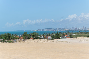 Fototapeta na wymiar Beautiful aerial image of dunes in the Natal city, Rio Grande do Norte, Brazil.