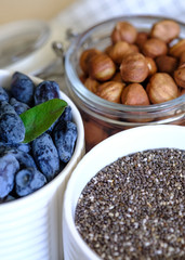 Healthy food with honeysuckle, granola and nuts, selective focus. The concept of a healthy food 
