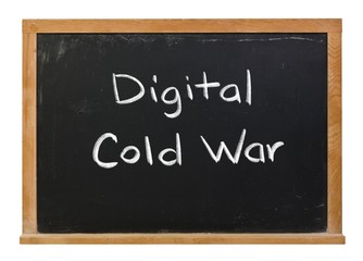 Obraz premium Digital cold war written in white chalk on a black chalkboard isolated on white