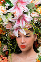 Naklejka premium Wreath of flowers background in Rose Red Pink fresh smell good Spring Summer for Beautiful Asian Woman portrait, Studio Lighting Campaign for Perfume, Cosmetic, Lipstick concept ads