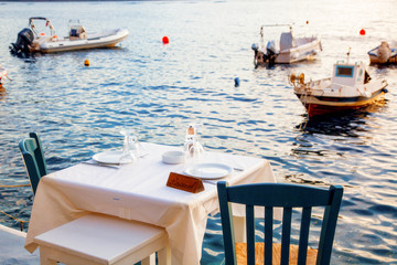 romantic dinner table by the sea Santorini, Greece