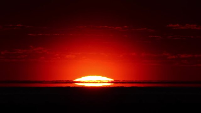 Red sunrise time lapse, close-up so intense it looks like nuclear blast, atomic bomb explosion.