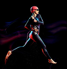 one caucasian woman triathlon triathlete studio shot isolated on black background with light...