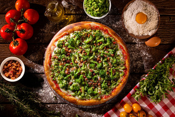 Pizza Broccoli and bacon on wood background. Top view, close up. Traditional Brazilian Pizza