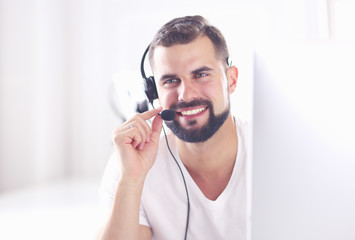 Businessman in the office on the phone with headset, Skype