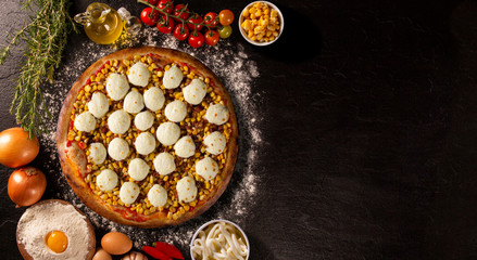 Pizza corn and cheese on Black concrete background. Top view, close up. Traditional Brazilian Pizza.