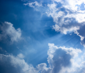Blue sky, sun lights and clouds scene