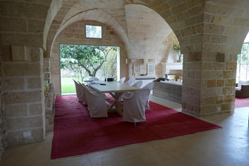 Dining room surrounding 2000 year old olive tree