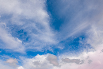 Naklejka na ściany i meble Dramatic fluffy clouds at morning sky