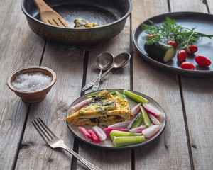 A quick and easy breakfast of scrambled eggs and vegetable cutting