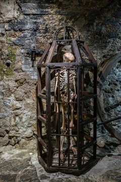 Medieval Metal cage with skeleton for torture