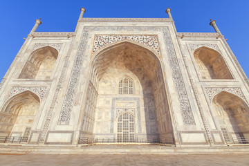 Fototapeta na wymiar Taj Mahal Agra white marble architecture close up view with medieval Mughal artwork
