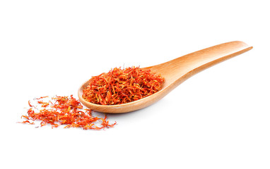 Safflower dried in wood spoon on white background