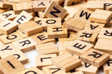 Heap of scrabble tile letters from above - Powered by Adobe